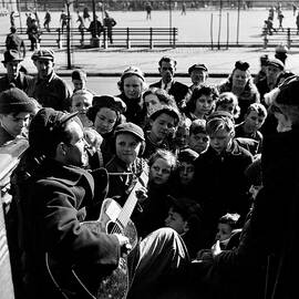 Woody Guthrie Performs On Stoop by Eric Schaal