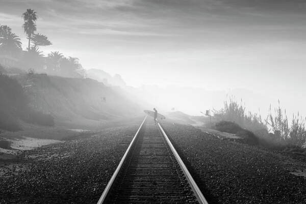 Surfer Walking Along Foggy Tracks Wall Art