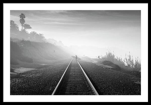 Surfer Walking Along Foggy Tracks Framed Print