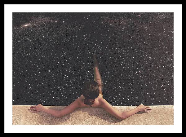 Woman Floating in Starry Pool Framed Print