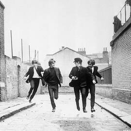 The Beatles Running In A Hard Days Night by Bettmann